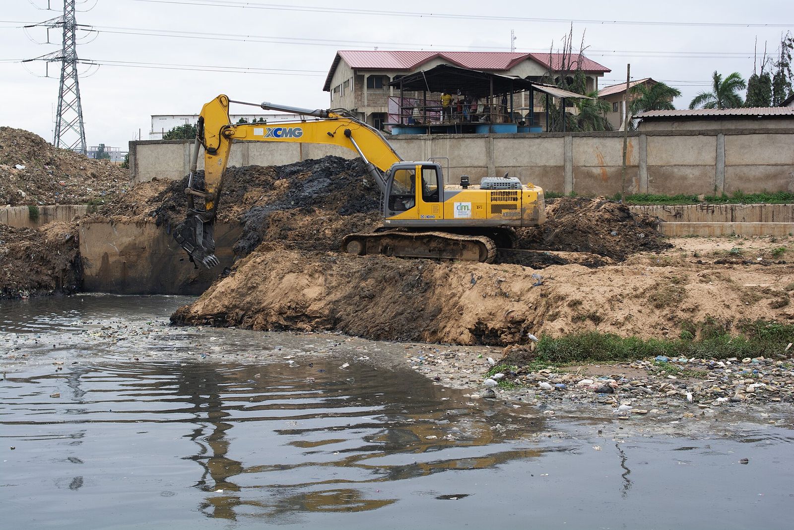 Excavator on drainage works in Ghana
